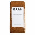 Wild Enclosures compressed coconut coir brick on white background with bioactive systems label, natural coco fiber substrate for reptiles, terrariums, plants, isopods, and vivariums