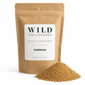 DubiaFuel premium Dubia roach food in a kraft stand-up pouch with a pile of finely ground powder on a clean white background. Feeder insect diet for Dubia roaches, crickets, and mealworms.