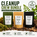 Cleanup Crew Bundle for bioactive terrariums featuring Wild Enclosures CrewCrumble isopod food, Microfauna Booster, and Springtail Food in resealable pouches displayed on leaf litter with live isopods and springtails, designed to support healthy bioactive vivariums and cleanup crews.